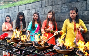 Women conducting traditional rituals for Shrawan