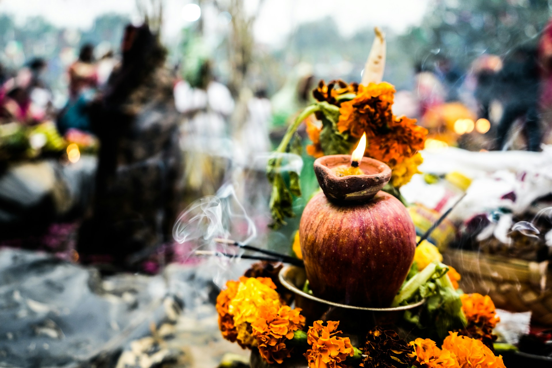 Traditional Oil Lamp and Floral Offering