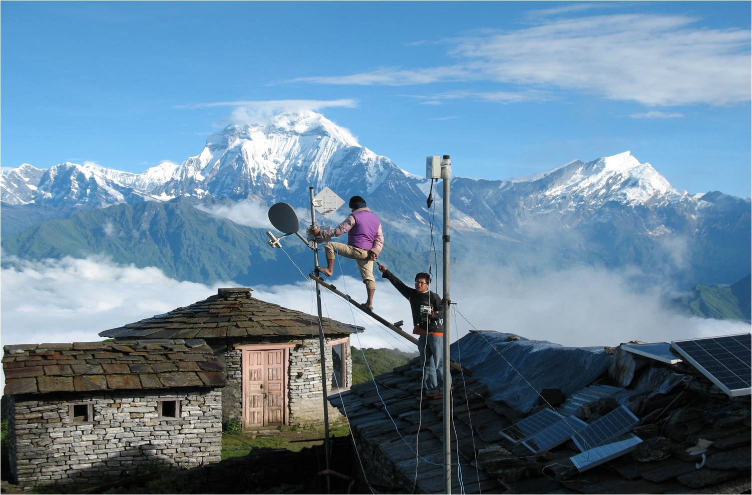 Men installing internet cables in Nepal