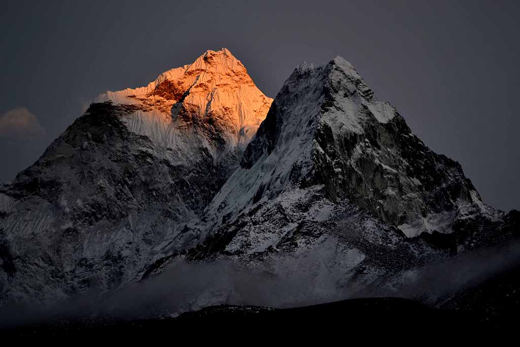 Sun Rays Illuminating the Mountain Peak